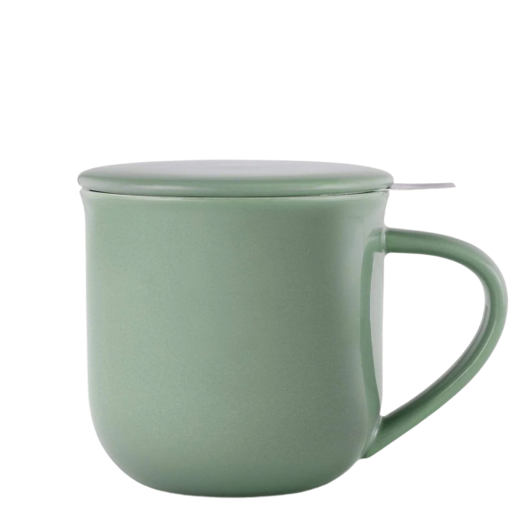 Green mug with a lid and tea infuser on a white background. The Spice & Tea Shoppe