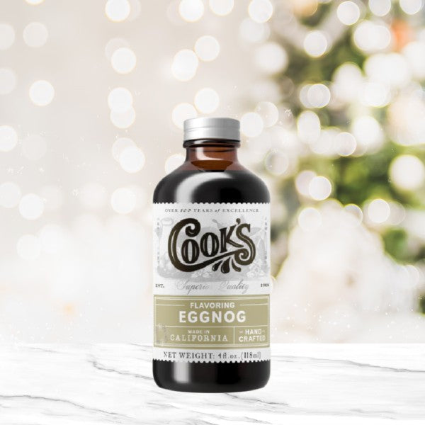 Bottle of Cook's Eggnog flavoring with a blurred festive background. The Spice & Tea Shoppe