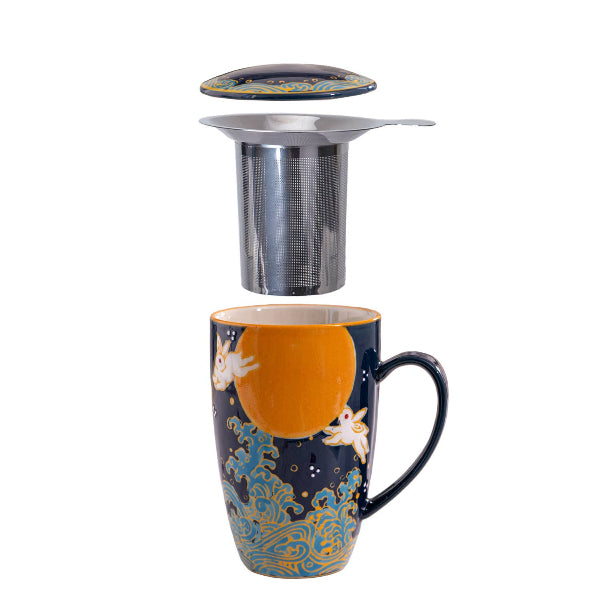 Decorative mug with a metal tea infuser on a white background. The Spice & Tea Shoppe