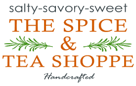 The Spice & Tea Shoppe logo featuring the tagline 'salty-savory-sweet' above the business name in orange serif font, with sprigs of rosemary framing the ampersand symbol and the word 'Handcrafted' in script below