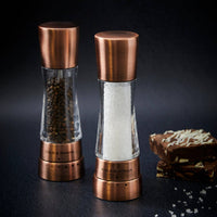A pair of Cole & Mason Derwent salt and pepper mills in a metallic copper finish.