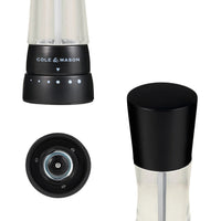 A product image showcasing a black Cole & Mason mill from three different angles, including the adjustable base, the top cap, and the underside mechanism.