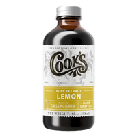 Bottle of Cook's lemon extract on a white background