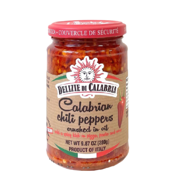 Jar of Delizie di Calabria Calabrian chili peppers on a white background. The Spice & Tea Shoppe
