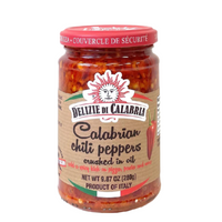 Jar of Delizie di Calabria Calabrian chili peppers on a white background. The Spice & Tea Shoppe