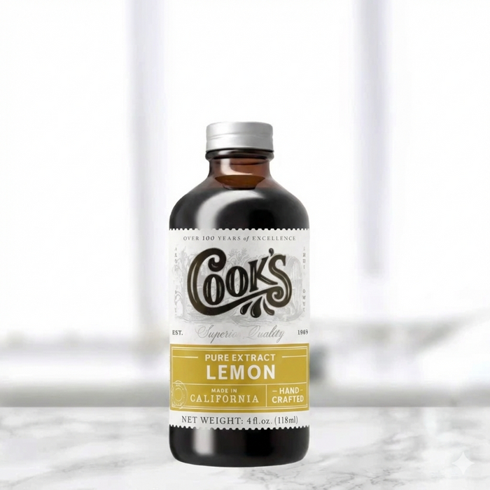 Bottle of Cook's Pure Extract Lemon on a white background