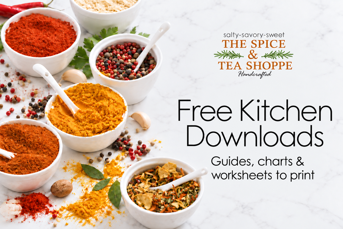 The Spice & Tea Shoppe free kitchen downloads: printable guides, charts and worksheets, with bowls of spices on a white marble tabletop.