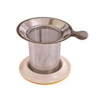 Metal mesh tea infuser on a white  surface