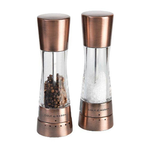 A pair of Cole & Mason Derwent salt and pepper mills in a metallic copper finish.